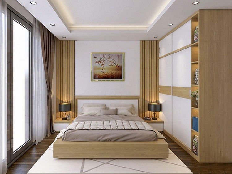 Phòng ngủ hiện đại với giường gỗ và đèn ngủ, thiết kế ánh sáng tinh tế và tranh treo tường nghệ thuật.