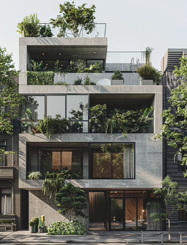 Nhà hiện đại ba tầng với nhiều cây xanh trên ban công, phong cách kiến trúc xanh bền vững.