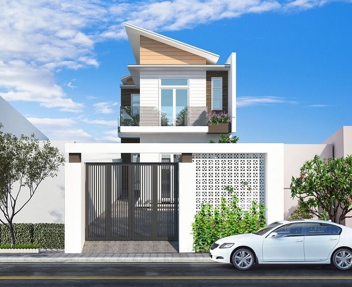 Nhà phố hai tầng hiện đại với mái nghiêng, thiết kế sáng tạo và ô tô đỗ phía trước.