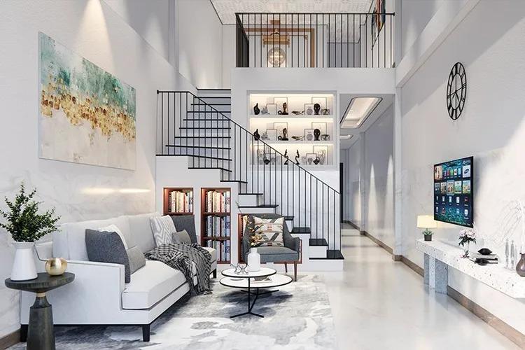 Phòng khách hiện đại với sofa trắng, cầu thang, kệ sách và TV trên tường. Trang trí tối giản và thoáng đãng.