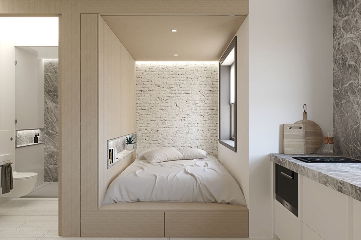 Phòng ngủ nhỏ gọn với giường gắn tường, thiết kế hiện đại và ánh sáng tự nhiên từ cửa sổ lớn.