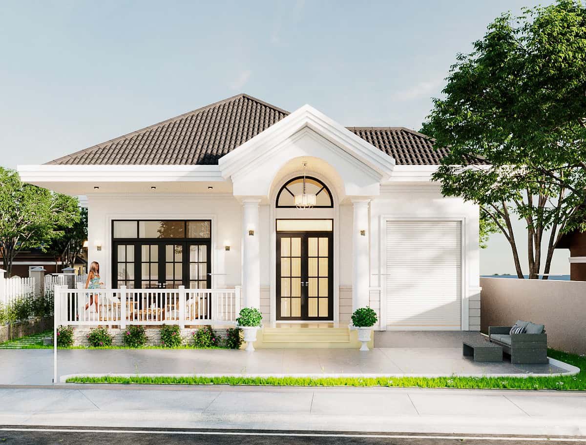 Nhà cấp 4 mái thái hiện đại với ban công, cây xanh và nội thất trang nhã, phong cách giữa không gian xanh tươi.