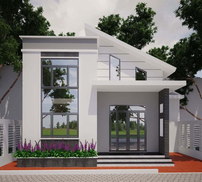 Nhà hiện đại mái nhọn, tường trắng và cửa kính, xung quanh có cây xanh và hoa trang trí trước sân.