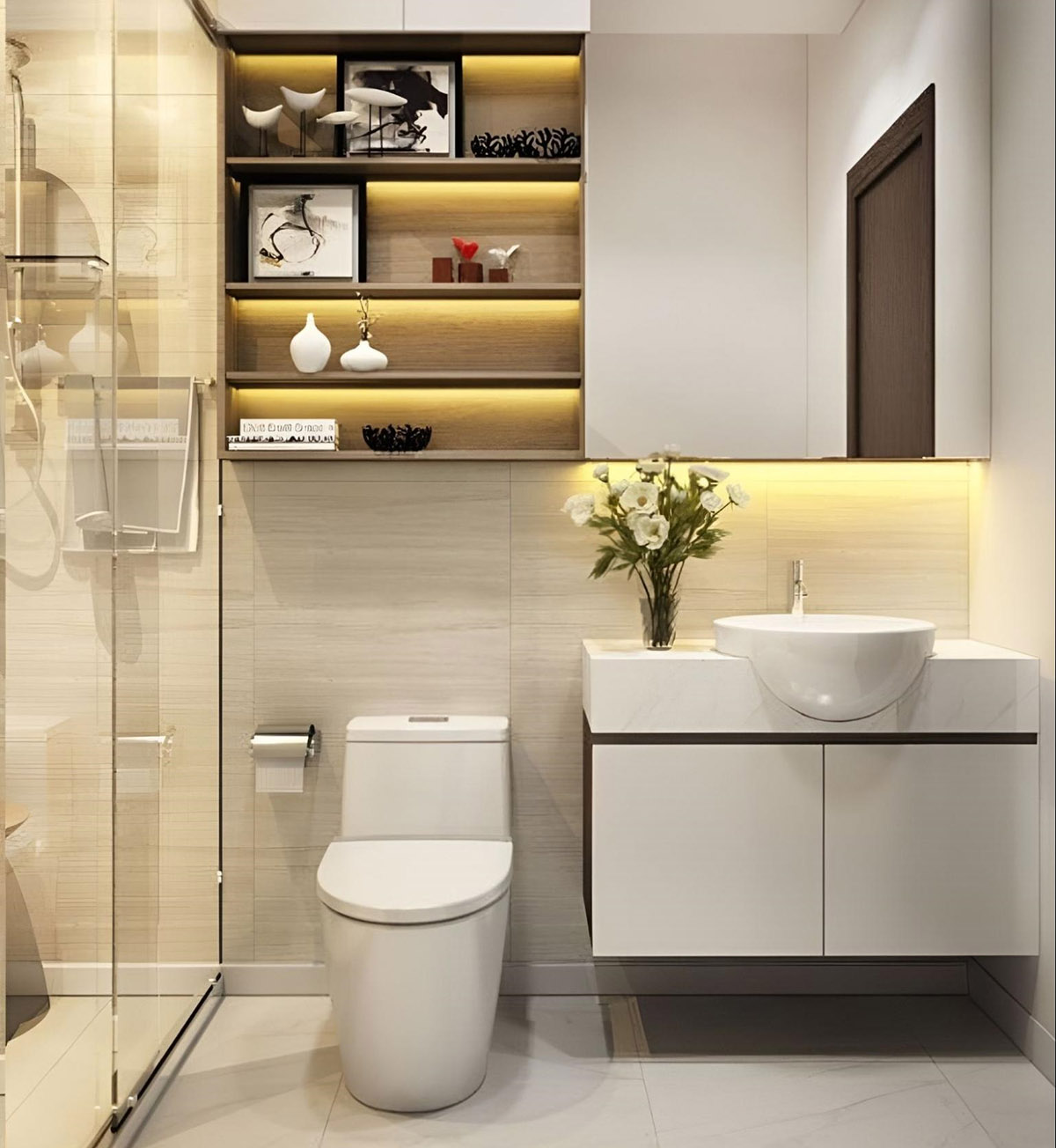 Phòng tắm hiện đại với bồn rửa trắng, đèn LED ấm và kệ trang trí tinh tế.