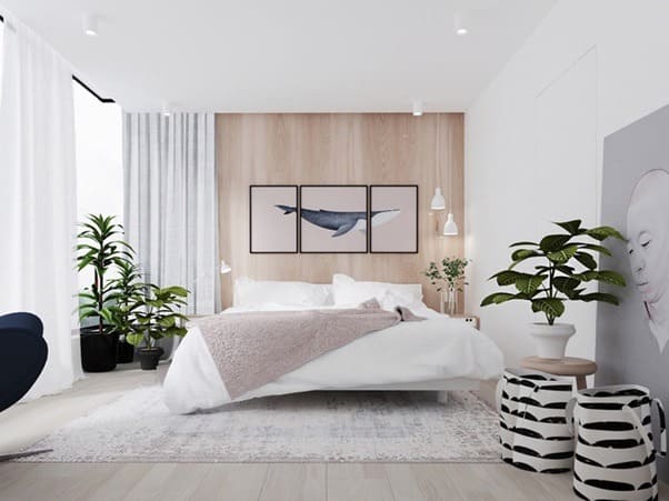 Phòng ngủ hiện đại với nội thất sáng, tranh cá voi, và cây xanh tạo cảm giác thư giãn và thoải mái.