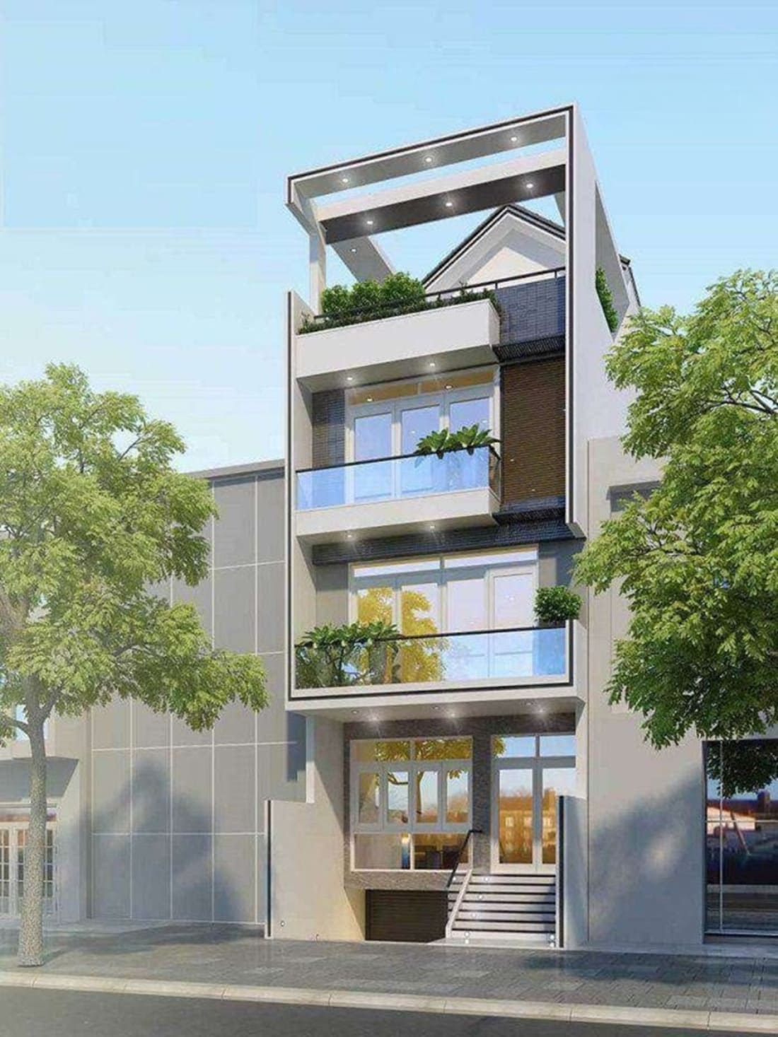 Nhà phố hiện đại với 3 tầng, ban công cây xanh, kính trong suốt, thiết kế tối giản, bên cạnh cây xanh.