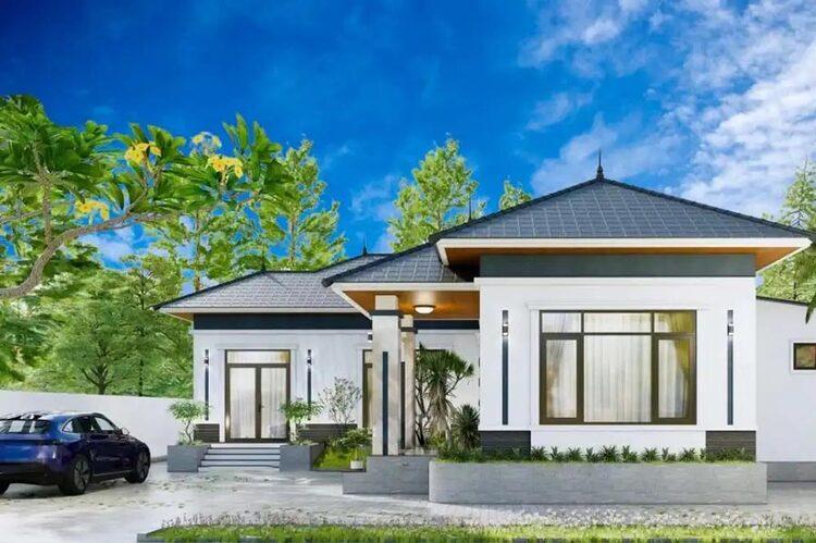 Nhà hiện đại một tầng với mái ngói, sân vườn xanh mát và xe hơi đậu trước, nền trời xanh trong.