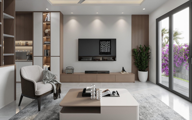 Phòng khách hiện đại với sofa, TV treo tường, bàn trà, cửa kính lớn nhìn ra vườn hoa tím.