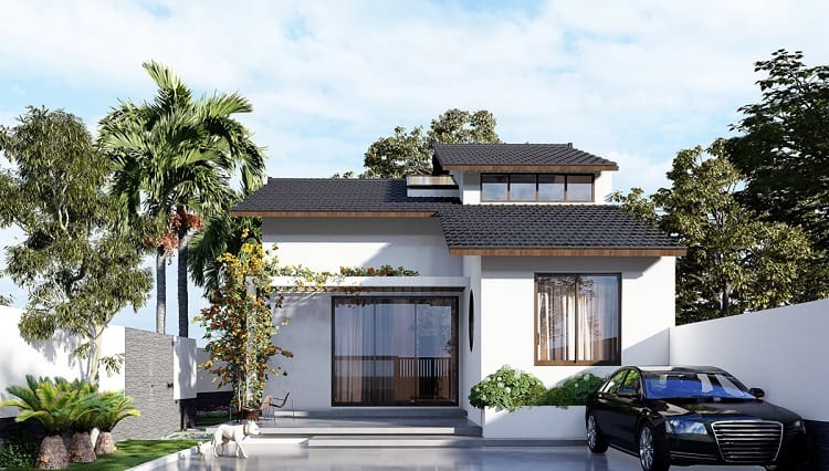 Nhà một tầng hiện đại với mái ngói đen, cây xanh tươi tốt, sân rộng và xe ô tô đỗ trước cửa.