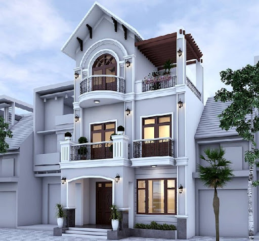 Ngôi nhà hiện đại ba tầng với mặt tiền màu trắng tinh tế, ban công rộng, điểm thêm cây xanh.
