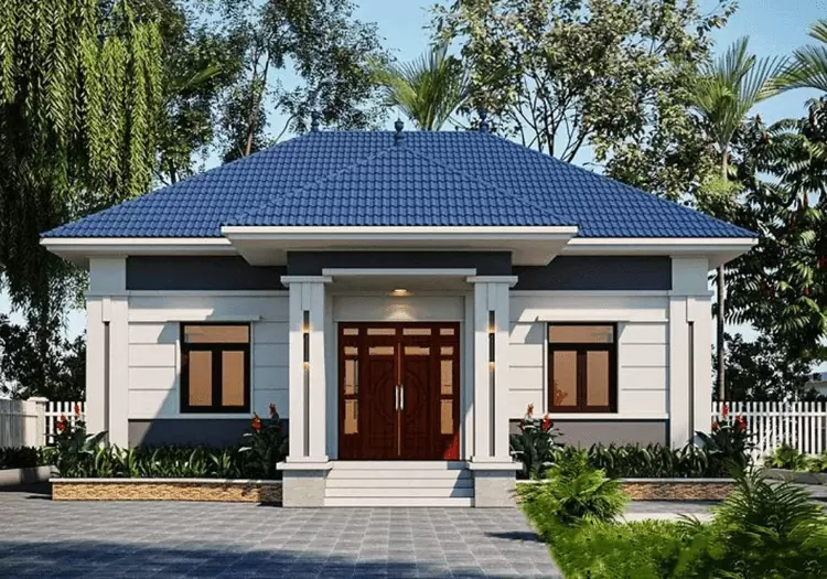 Nhà cấp 4 với mái ngói xanh, mặt tiền phong cách hiện đại, bao quanh bởi cây cối xanh mát, không gian sống tiện nghi.