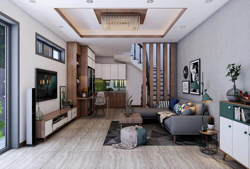 14-13 Phòng khách hiện đại với sofa xám, đèn trần độc đáo và cầu thang gỗ dẫn lên tầng trên.