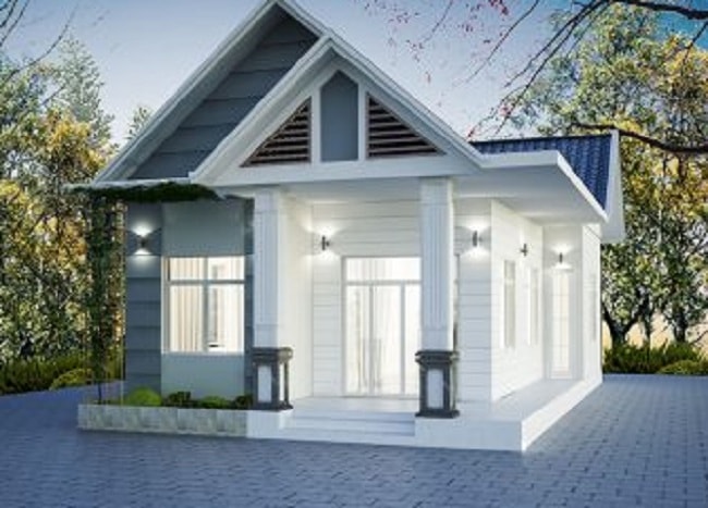 Nhà cấp 4 mái thái hiện đại màu trắng xám, sân gạch rộng rãi, thích hợp cho gia đình nhỏ, kiến trúc đơn giản, tinh tế.