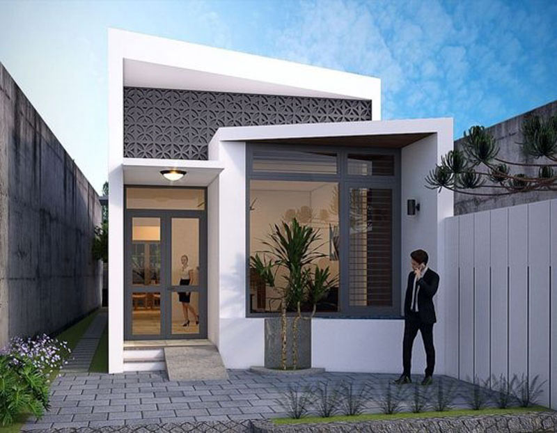 Ngôi nhà cấp bốn hiện đại với cửa kính lớn, sân lát gạch và cây xanh, lý tưởng cho gia đình nhỏ sống ở đô thị.