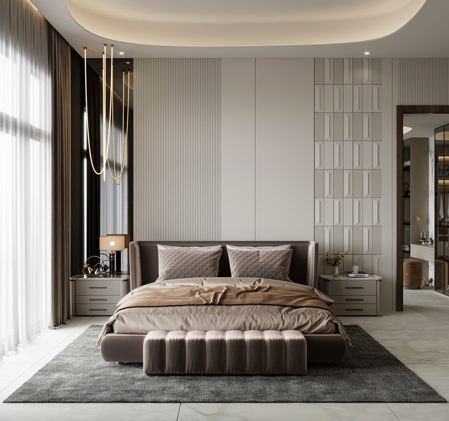 Phòng ngủ sang trọng với nội thất hiện đại, giường rộng, đèn trang trí và thảm xám tạo sự thoải mái.