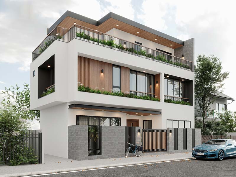 Nhà phố hiện đại ba tầng với mái bằng và gara, bên cạnh xe hơi xanh và cây tạo cảnh quan.