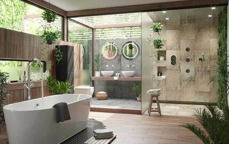 Phòng tắm hiện đại với bồn tắm, cây xanh và ánh sáng tự nhiên qua cửa kính lớn.