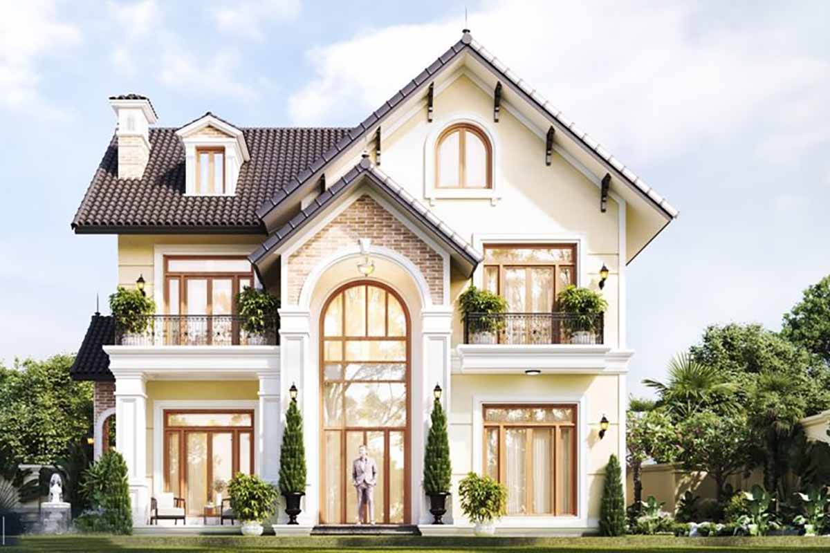 2-5-1-1 Biệt thự hai tầng phong cách cổ điển với mái ngói đen, cửa kính lớn và cây cối xanh xung quanh.