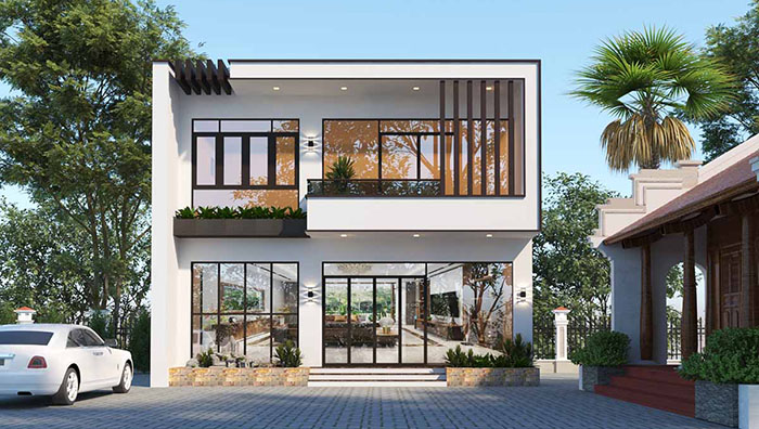 Nhà hiện đại hai tầng với cửa kính lớn, xung quanh có cây xanh và ô tô trắng tại sân.