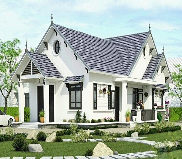 Ngôi nhà cấp một hiện đại với mái ngói xanh, sân vườn tươi tốt, phong cách kiến trúc mát mẻ và hiện đại.