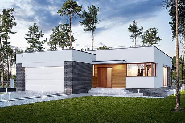 Ngôi nhà hiện đại với thiết kế tối giản, mái bằng cạnh khu rừng cây xanh mát, lối đi lát gạch trắng.