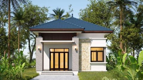 Ngôi nhà nhỏ với mái ngói xanh, cửa sổ lớn, bao quanh bởi cây cối xanh tốt và bầu trời trong.