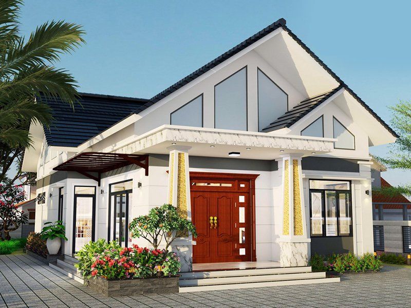 Nhà cấp 4 hiện đại, mái thái màu trắng, cửa gỗ, cây xanh tạo điểm nhấn, thiết kế thoáng đãng với sân rộng, thích hợp cho gia đình trẻ.