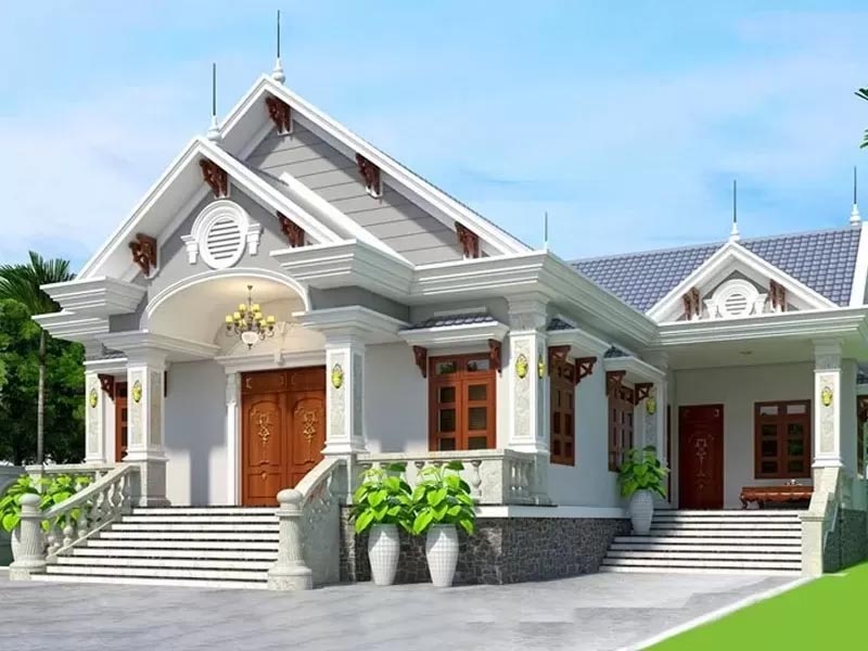 Nhà cấp 4 mái ngói sang trọng, kiến trúc tân cổ điển, sân vườn rộng rãi, có cây xanh và ánh sáng ban ngày.