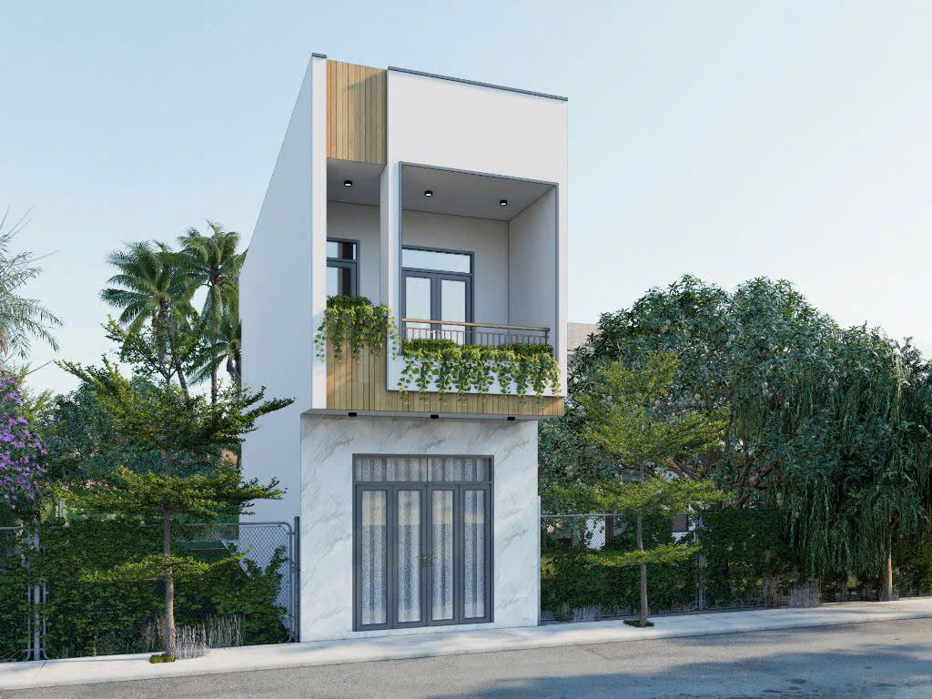 Nhà phố hiện đại 2 tầng với ban công xanh mát, mặt trước ốp đá trắng.