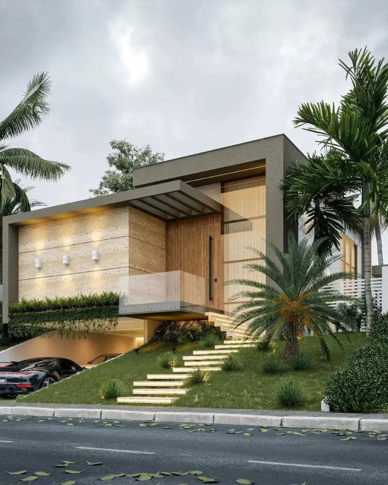 Nhà hiện đại 1 tầng, thiết kế tối giản, có sân vườn xanh mát, nằm bên đường với xe ô tô đậu bên dưới.