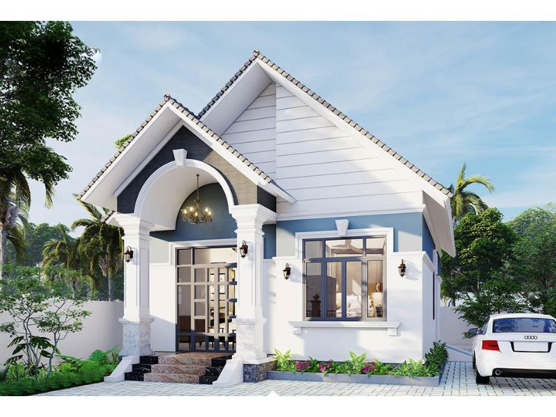 Ngôi nhà hiện đại mái thái với sân rộng, cây xanh mướt và xe hơi trắng đậu bên cạnh.