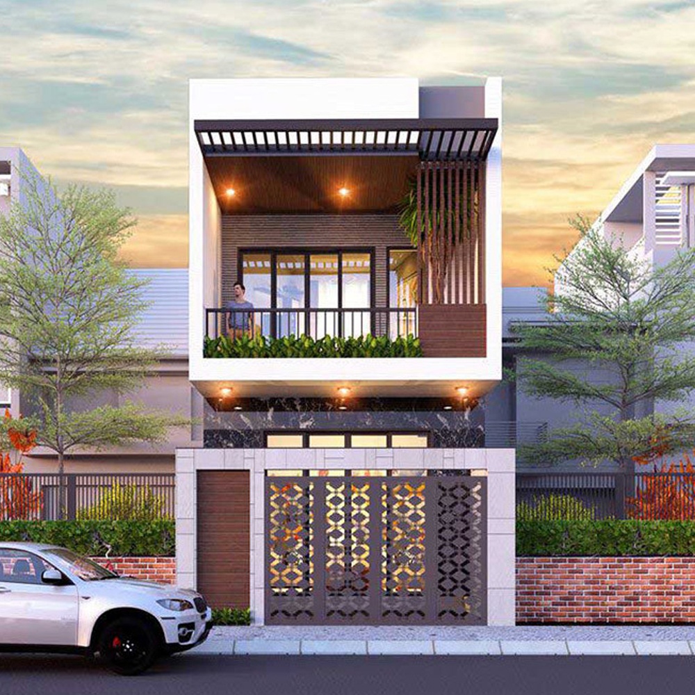 Nhà phố hiện đại hai tầng với ban công rộng và ô tô trắng đậu phía trước vào lúc hoàng hôn.