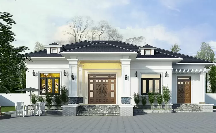 Ngôi nhà một tầng với lối kiến trúc hiện đại, mái ngói đen và cửa gỗ nổi bật giữa không gian thiên nhiên xanh mát.