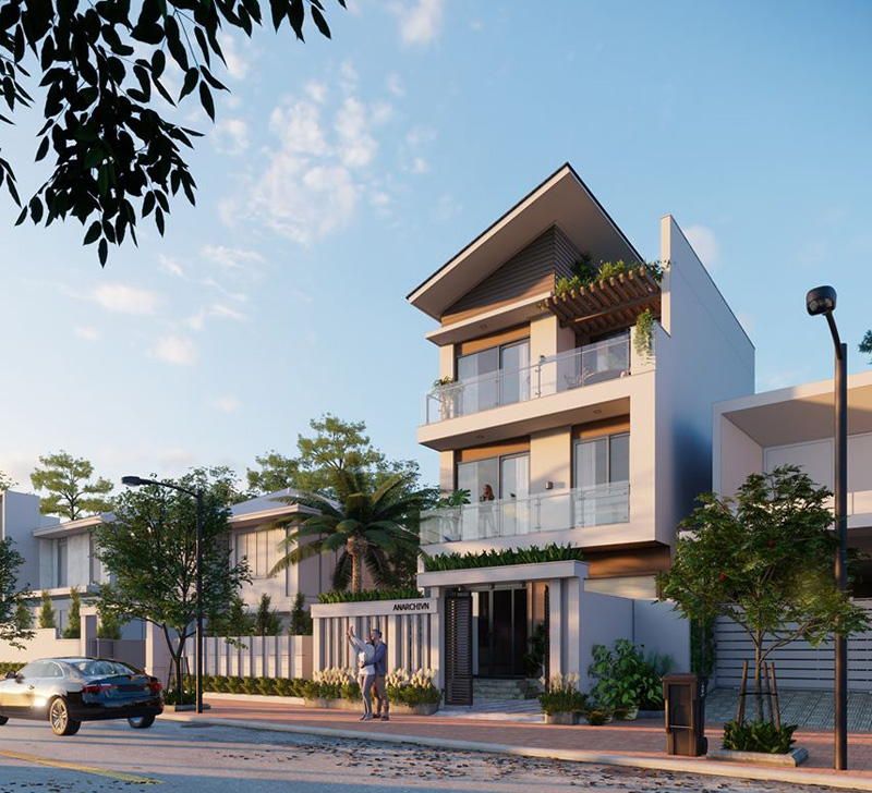 Nhà phố hiện đại với ba tầng, cửa kính lớn và cây xanh, nằm trên con đường xanh mát dưới ánh nắng ban mai.