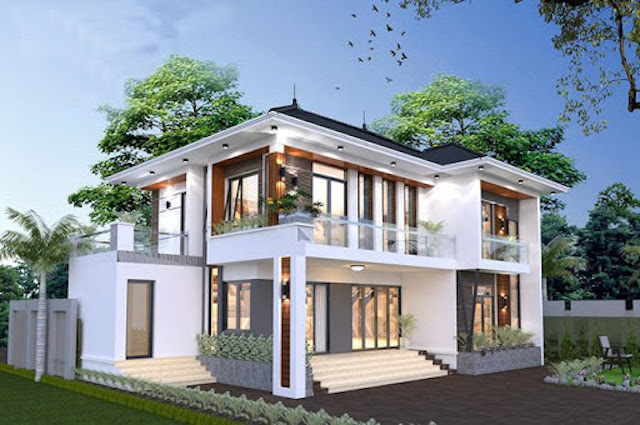 Biệt thự hiện đại hai tầng với mái chéo và cửa kính rộng, bao quanh bởi cây xanh và sân vườn xanh.