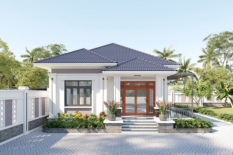 Ngôi nhà cấp 4 mái thái hiện đại với sân vườn rộng, cây xanh xung quanh và cổng lớn phía trước.