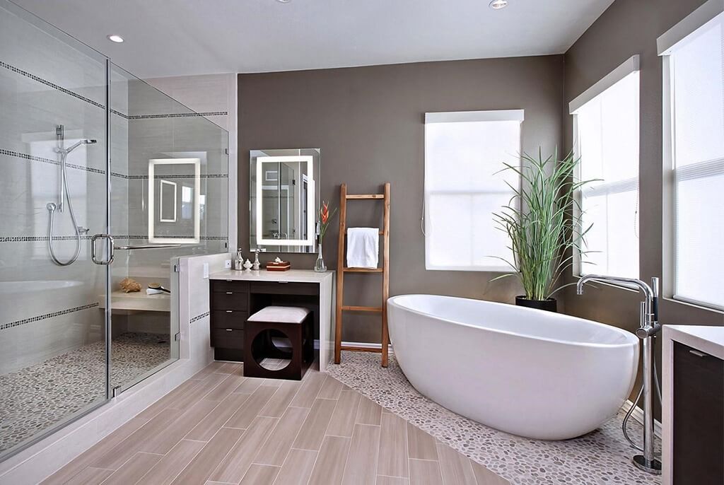 4bsc65ujfgev3mthxwia Phòng tắm hiện đại với bồn tắm, vòi sen kính và cây xanh, tông màu trung tính tạo cảm giác thư giãn.