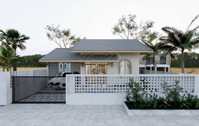 Nhà phố hiện đại với mái ngói xám, sân trước rộng và hàng rào trắng, bao quanh bởi cây cối xanh tươi.