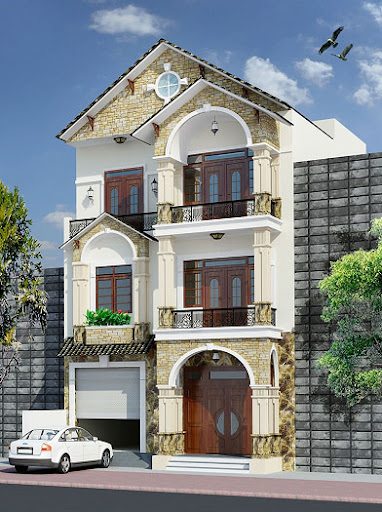 Tòa nhà ba tầng với thiết kế sang trọng, mặt trước làm từ đá và có cửa gỗ, xe hơi trắng đậu phía trước.