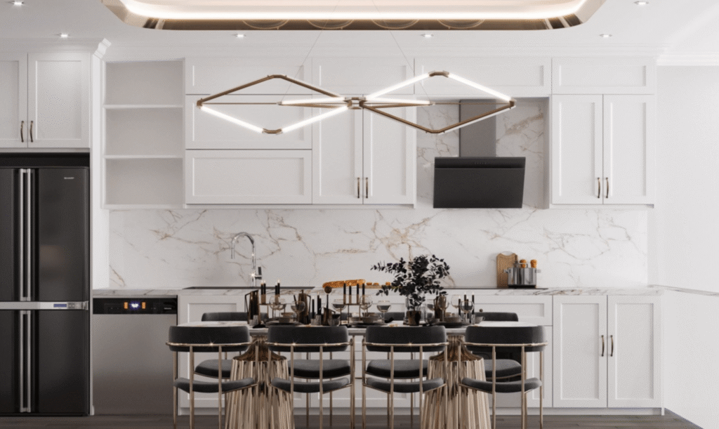 Nhà bếp sang trọng với bộ bàn ăn và đèn trần hiện đại, tủ bếp trắng và tường ốp đá cẩm thạch.