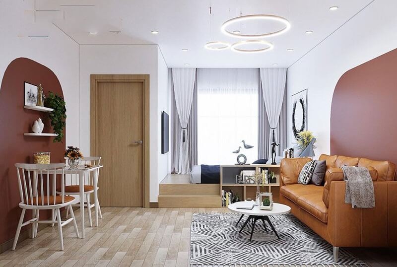 Phòng khách hiện đại với sofa da, bàn trà trắng và đèn trần LED, thiết kế không gian mở và tối giản.