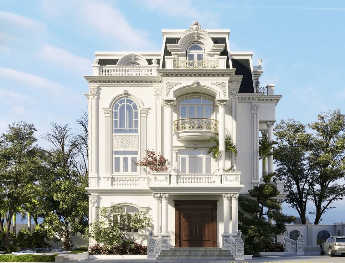 Biệt thự tân cổ điển màu trắng với ban công và cửa sổ lớn, xung quanh là cây xanh, bầu trời trong xanh.