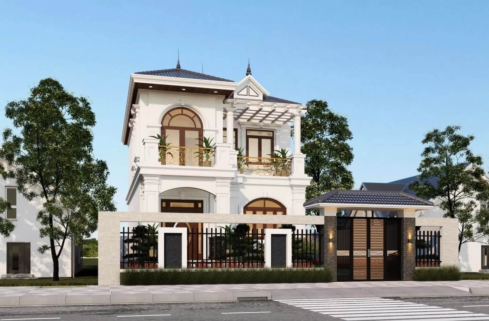 Biệt thự hai tầng sang trọng với cổng lớn, cây xanh xung quanh, thiết kế hiện đại, mái ngói xanh đậm.