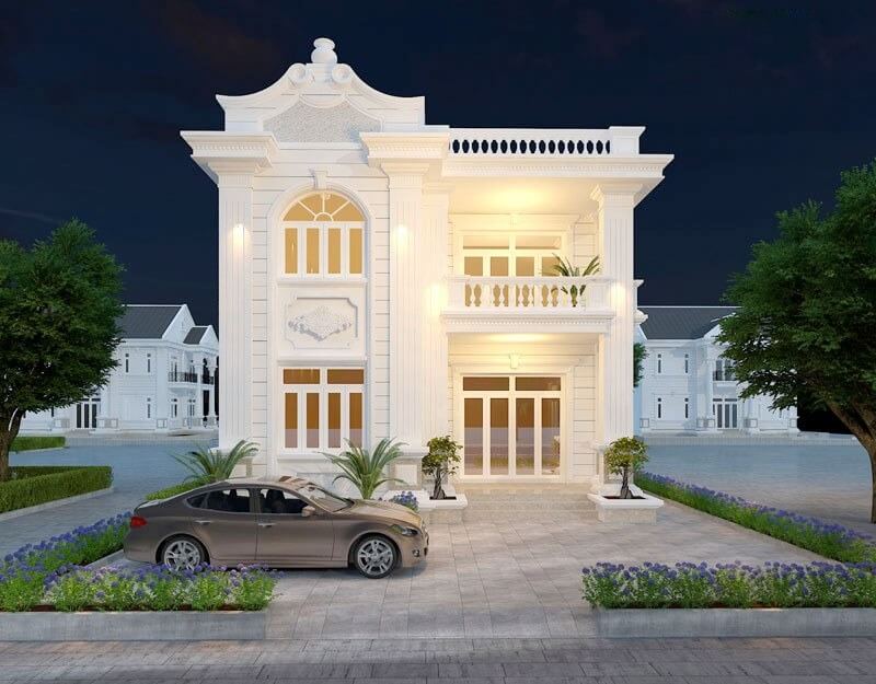 Biệt thự sang trọng kiến trúc tân cổ điển, đèn ban đêm rực rỡ, ô tô đỗ phía trước, cây xanh tạo cảnh quan đẹp.