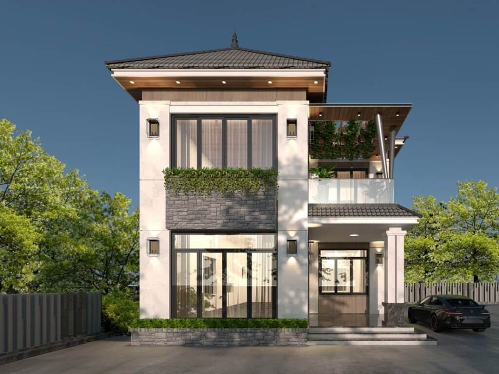 Ngôi nhà hiện đại hai tầng với cửa kính lớn và ban công, bên ngoài trồng cây xanh tạo không gian thoáng đãng.