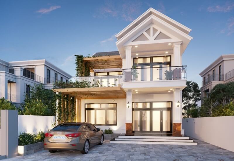 Nhà hai tầng hiện đại với giàn cây leo và xe hơi đỗ phía trước, ban ngày.