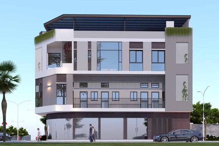 Tòa nhà hiện đại ba tầng với các cửa sổ lớn và cây xanh trang trí bên ngoài.
