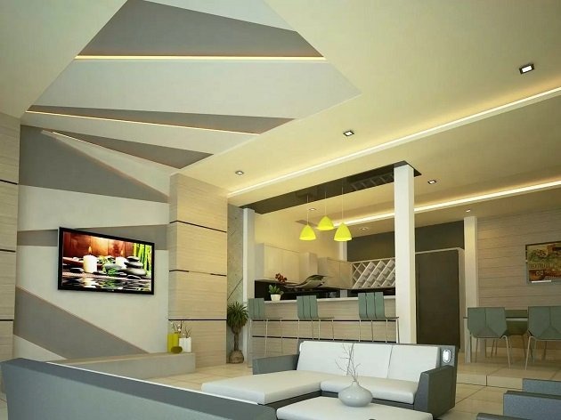 cac-yeu-to-can-luu-y-khi-chon-vach-ngan-thach-cao-ben-dep-2 Phòng khách hiện đại với sofa da trắng, đèn vàng treo trần và TV màn hình phẳng, thiết kế nội thất tinh tế.