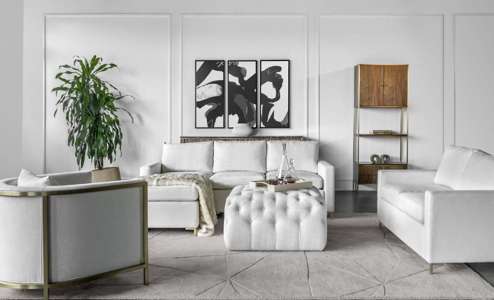 Phòng khách hiện đại với ghế sofa trắng, bàn đẩu và cây xanh trang trí.