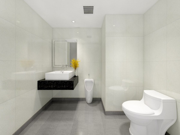 Nhà vệ sinh hiện đại với bồn cầu, bồn rửa mặt trắng, gương và tường lát gạch sáng, thiết kế rộng rãi và tối giản.